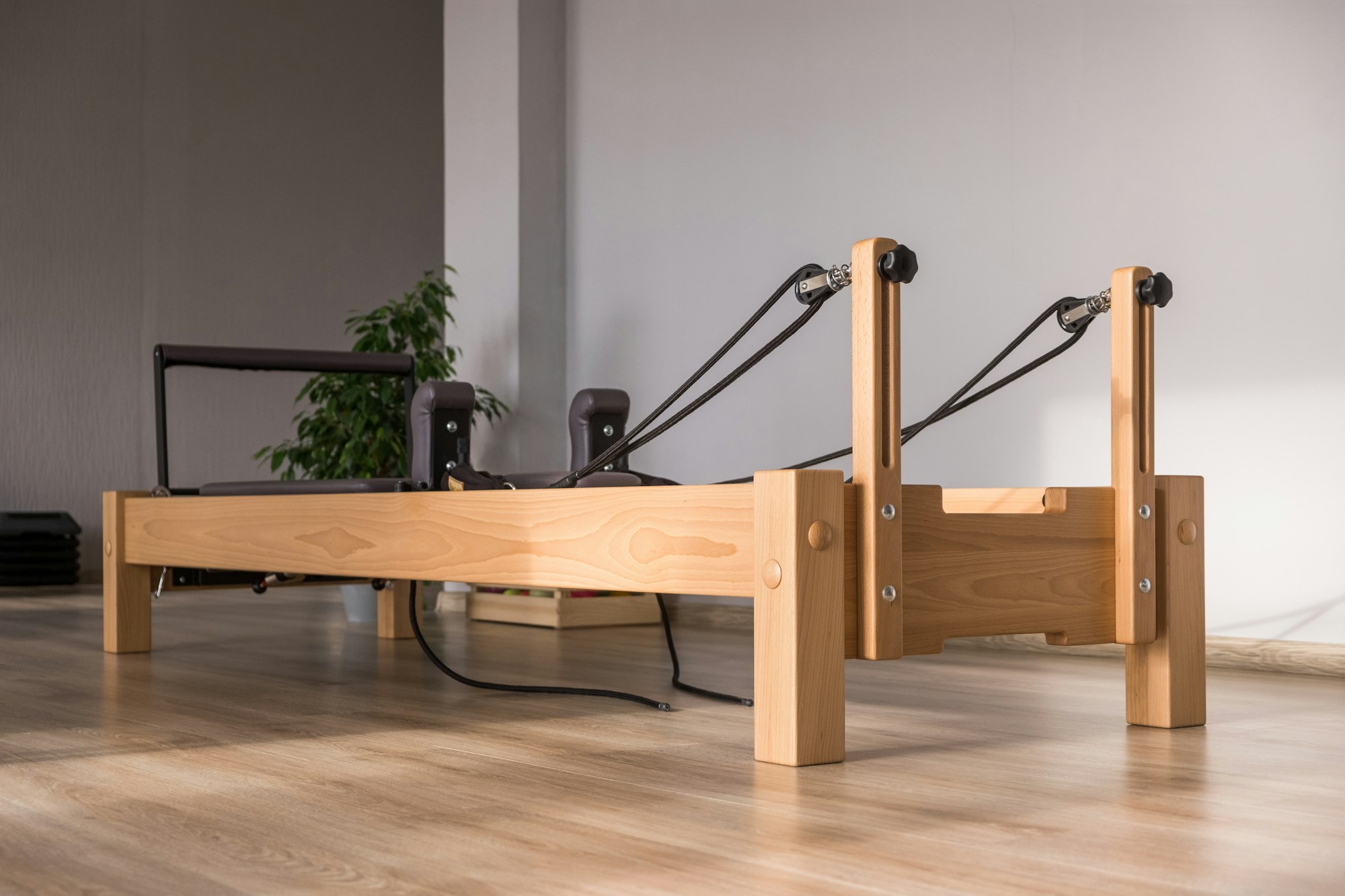 Pilates equipment. Reformer bed. Reformer pilates studio machine for fitness workouts in gym. Fit